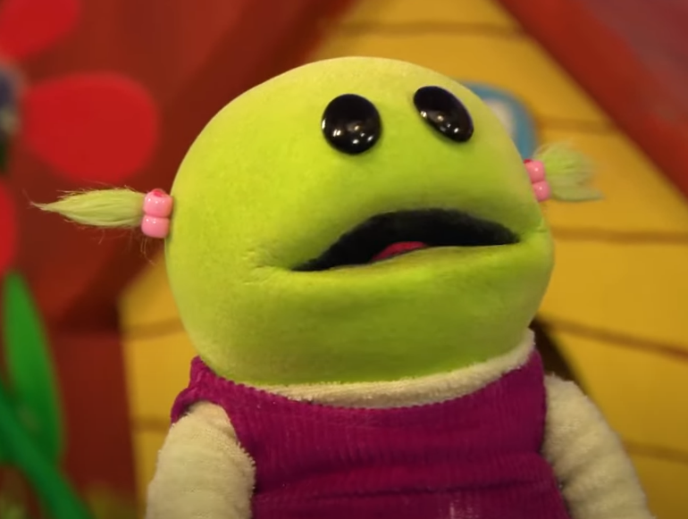 Green female puppet from children's TV show