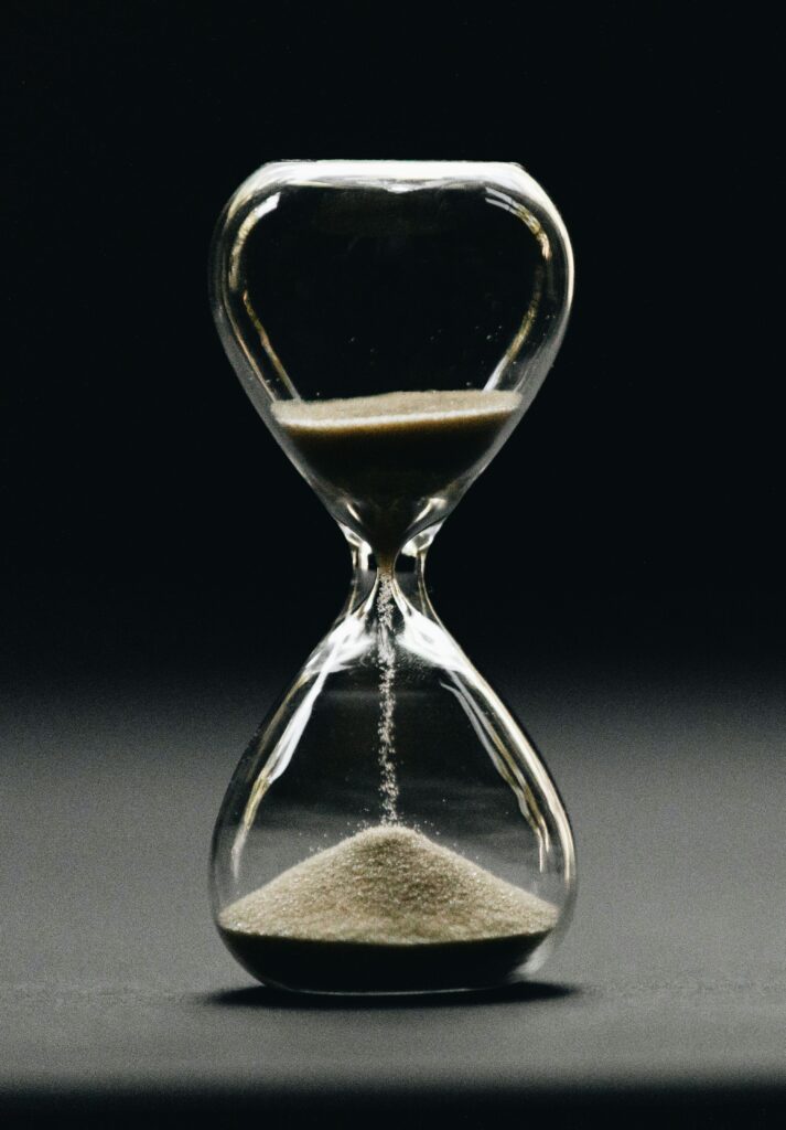 active hourglass on black surface