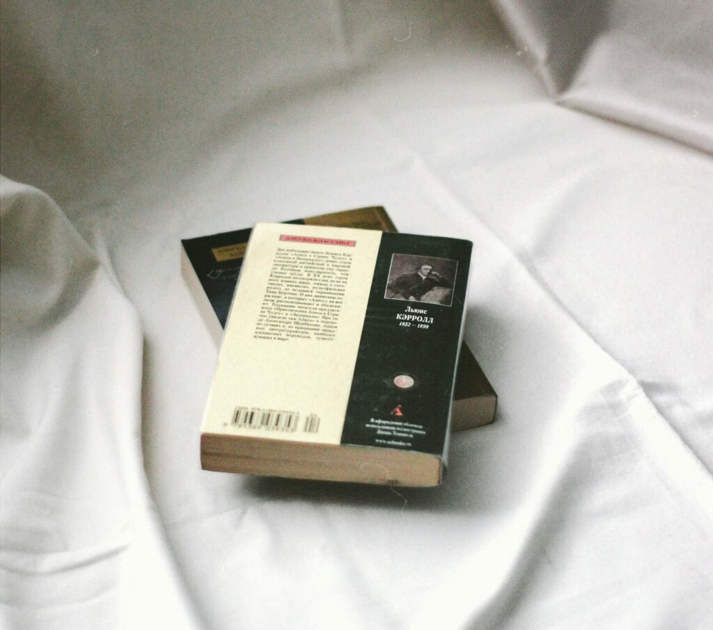 two books on white fabric